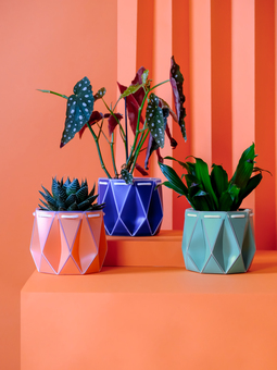 Origami self watering plant pot made from recycled plastic