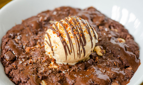 Salted Caramel Ice Cream served on a baked brownie (serving suggestion)