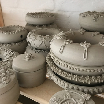 handmade pottery with piping before firing