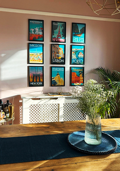 Gallery wall featuring travel poster collection