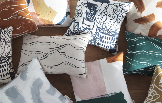 Emma Alviti cushion collection on the floor with sunlight