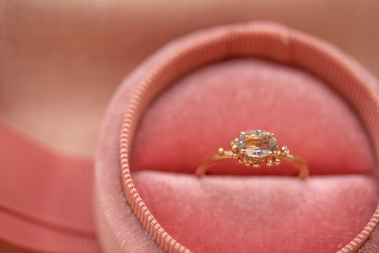Peach sapphire and granulated gold engagement ring