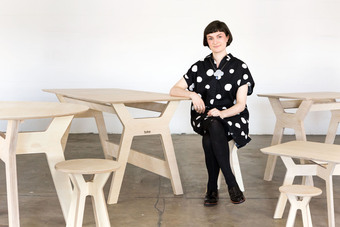 Alice Jacobs sitting at Ply-Works Plywood Desk