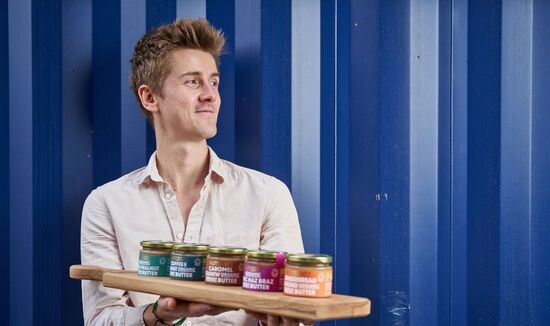 Nutcessity Nut Butter is now on Not On the High Street. This image contains founder Mike displaying his range of gourmet, organic, vegan nut butters. Delicious!