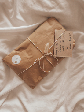 rustic packaging in neutral tones. gift wrapping in parcel paper and string