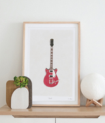 A framed art print featuring a handprinted Gretch guitar by Emma Bryan Design