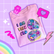 A colourful pink, printed crew neck 100% organic cotton sweater featuring a 90's style illustration inspired by 1990s vintage retro polly pocket toys