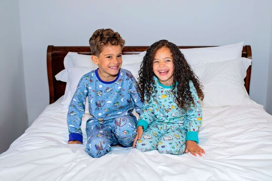 Image of two children wearing Ducky Zebra Pyjamas