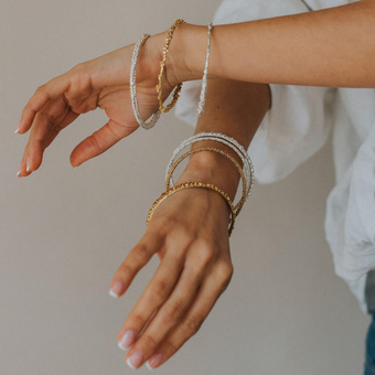 Dainty London Jewellery model wearing earrings