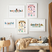 A kids room gallery wall displaying hand painted illustrated personalised name prints and birth prints
