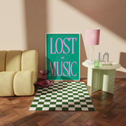 framed print that says 'lost in music' green and pink colours.