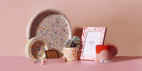 Collection of colourful terrazzo trays, pots, coasters and photo frames