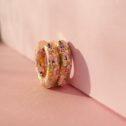 Chunky hoop earrings with daisy flower charm