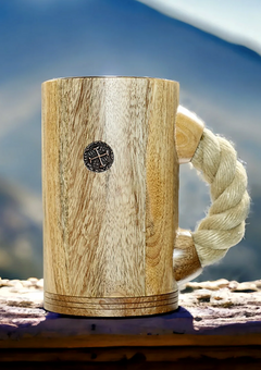 chuug rope handle coffee mug beer tankard with light rope and light oak wood finish outdoors in the mountains with pirate coin inlay