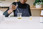 Ibi mixing oils at her desk