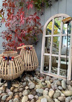 Collection of bamboo lanterns and garden mirror