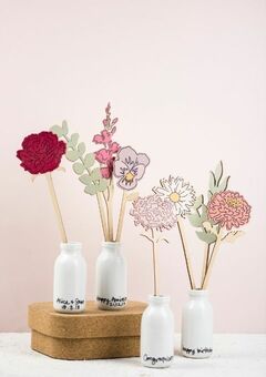 Wooden birth flowers in personalised, ceramic bottles