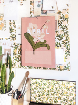 A floral wall calendar - each page decorated with large floral illustrations