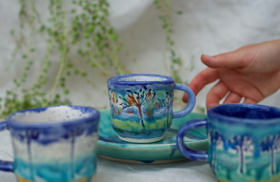 Stacks of Kezia May Ceramics mugs