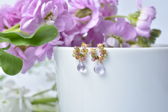 An image of dainty and delicate tourmaline and pink amethyst drop earrings from the brand mamie coco atelier