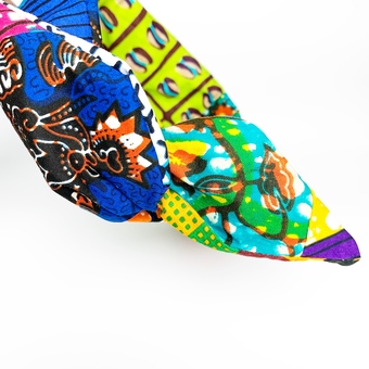 A patchwork African fabric print, wired headband. Tied in a bow