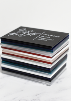 Stack of save the dates in various colours