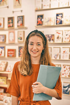 Portrait of Emily Nash Illustration trade show stand