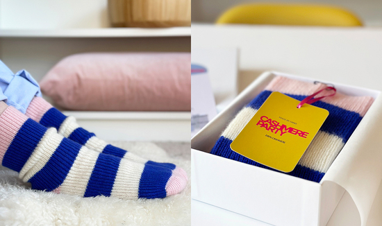 Handmade cashmere socks in bright blue and cream stripes with a pink cuff, heel and toe.  Also shown in a gift box.