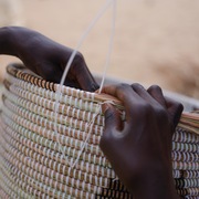 Weaving using sustainable ndiorokh grasses and repurposed plastic