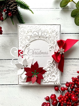 Handmade Christmas Card. Rectangular. Intricate die cut card layers with paper red and white Poinsettia flowers red satin ribbon and a crystal snowflake  