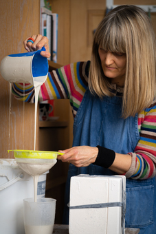 Hanne Rysgaard sieving the porcelain slip