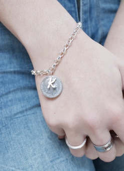 Lucky sixpence and initial bracelet