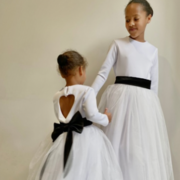 long sleeve white sparkly tutu dress with a heart cut out back & a large satin bow sash, flower girl dresses