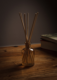 Aromatherapy reed diffuser on wooden table