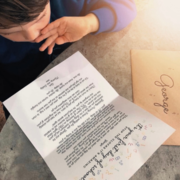 Child reading First Day of School letter