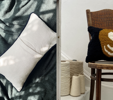 A twofolde tufted cushion back made from dead-stock Irish linen and another one of our cushions next to the yarn used to create it.