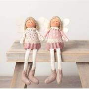 Set of two handmade spring dolls with floral outfits, lace detailing, angel wings, striped skirts, and soft boots, seated on a rustic wooden bench