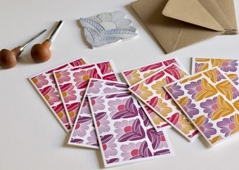 Vibrant and colourful notecard sets featuring abstract linocut flowers in a colourful repeating pattern