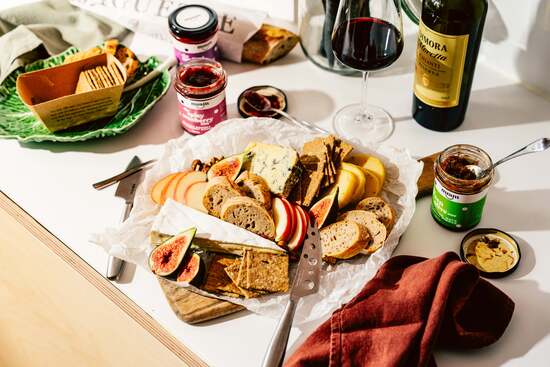 cheese board with pickles and sauces