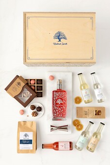 a craft spirits gift pack with a bottle of rum, Kindred Spirits tumblers and botanicals