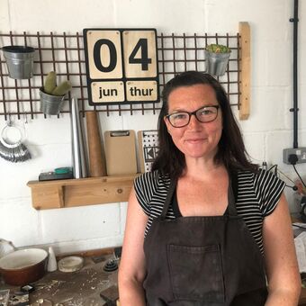 Katherine Barber and her jewellers bench
