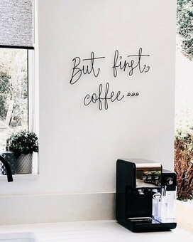 But first coffee Wire words on a kitchen wall