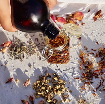 natural skincare oil infusion with calendula petals and herbs 