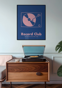Record Club print hung on a wall above a record player