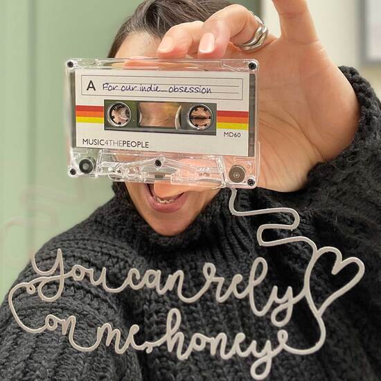 Caro holding a papercut. tape