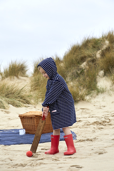 Keeping the chill out.  Fred is wearing our hooded towelling cover up in Navy/White