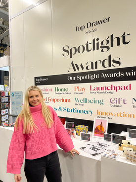Stood in front of the spotlight awards after receiving award for best new product.