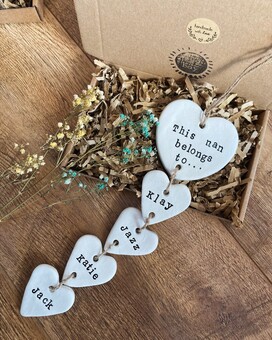 handmade clay hearts stamped with names