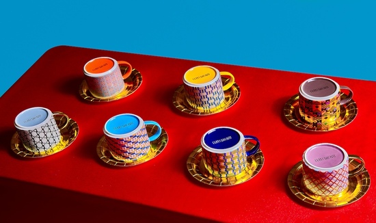 A snapshot of African mugs on a table with the bases up. These cups are from the Cuppashanti brand and show the Kentemania collection