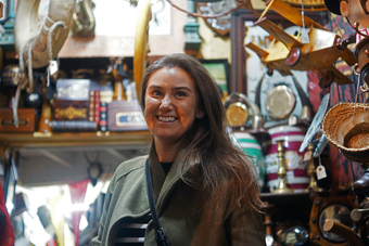 Charlotte hunting for vintage items in antique markets
